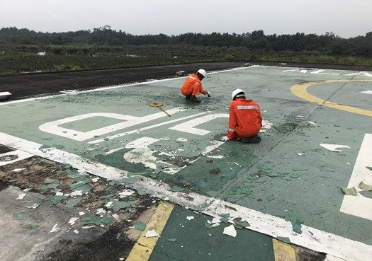 Helipad Paint Stripping
